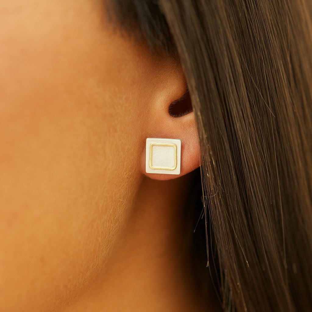Sterling silver earrings with 18cty gold detail on ear