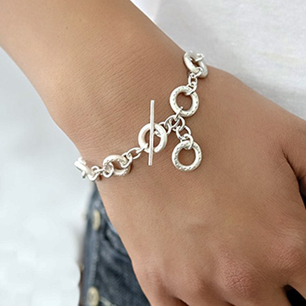 Dotty silver donut bracelet on the wrist