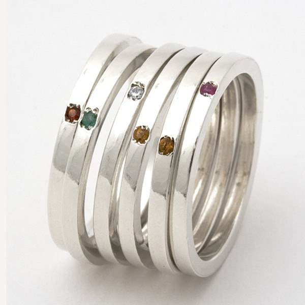 collection of silver birthstone stacking rings